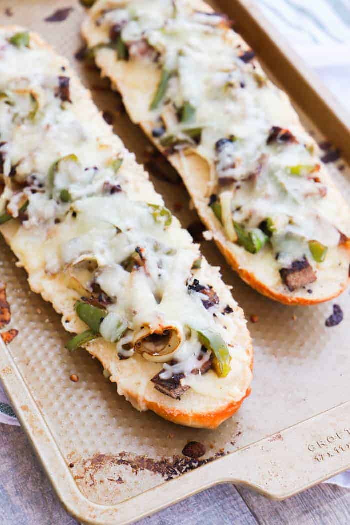 Philly Cheese Steak French Bread Pizza on a baking sheet