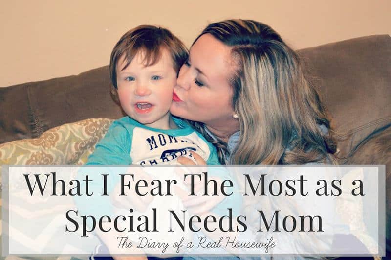 Mother kissing son with cerebral palsy on the cheek