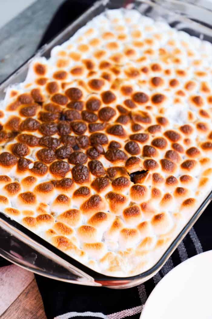 S'mores Poke Cake in a baking dish ready to serve