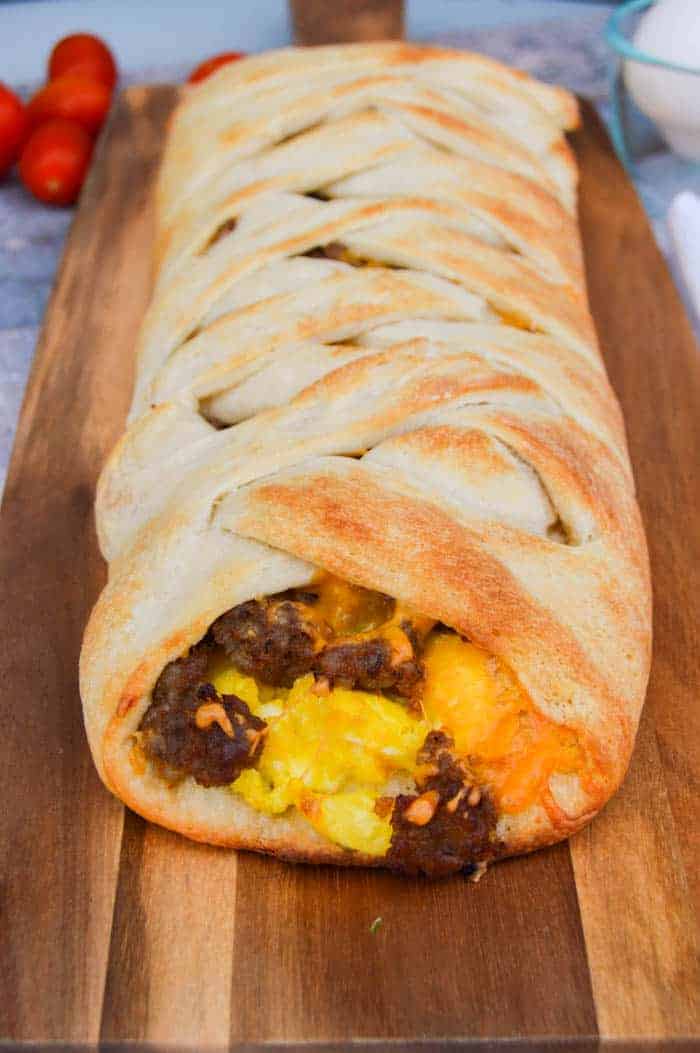 sausage egg breakfast braid on wooden serving board