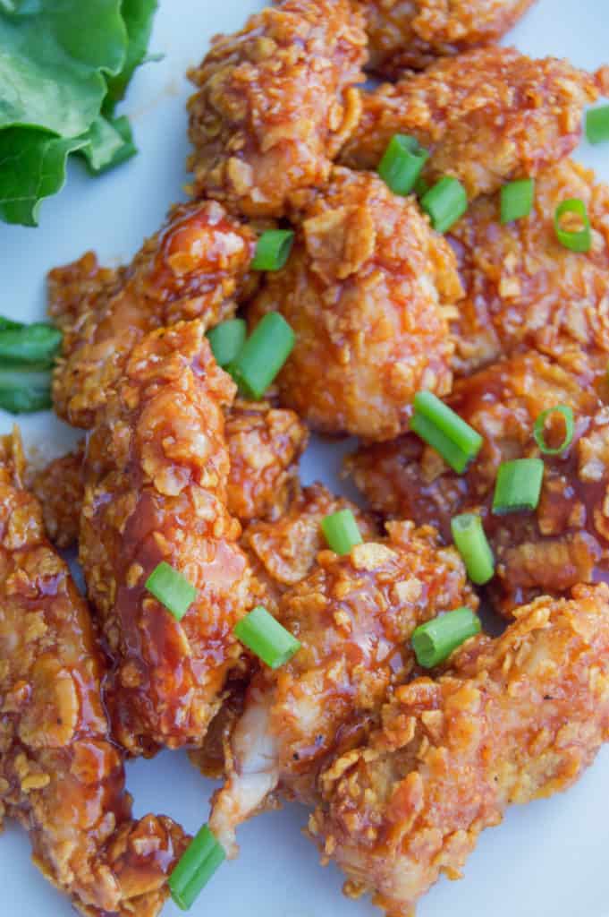 Honey BBQ Chicken Bites on white plate close up