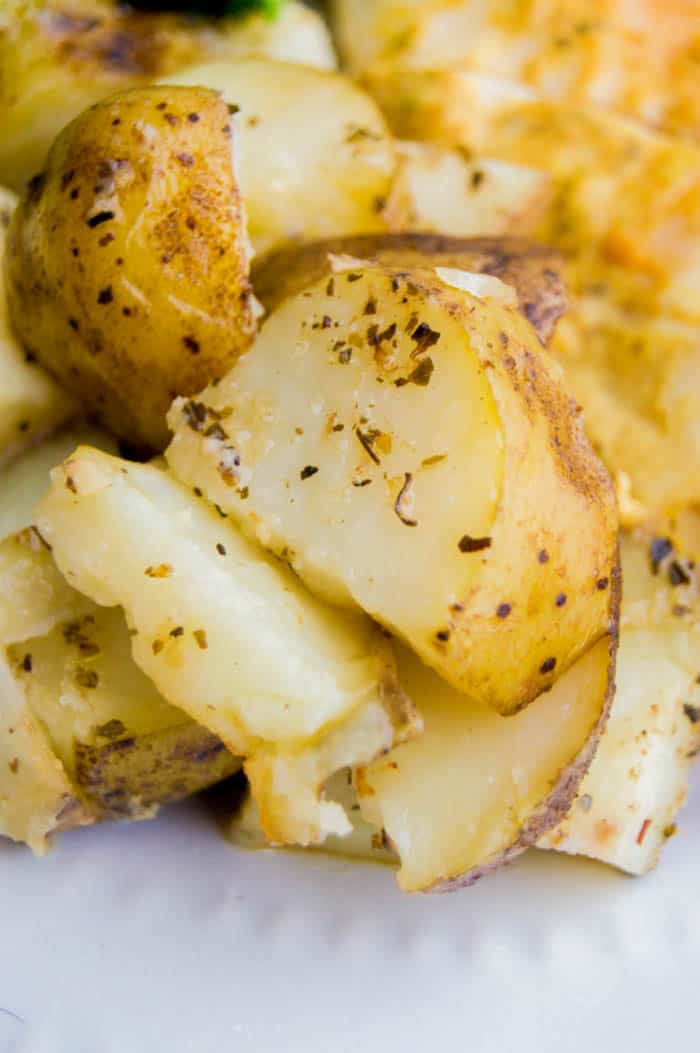 closeup of Italian potatoes on white plate