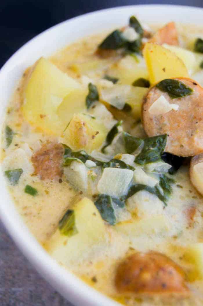 close up picture of Creamy Smoked Sausage Spinach and Potato Soup in a bowl