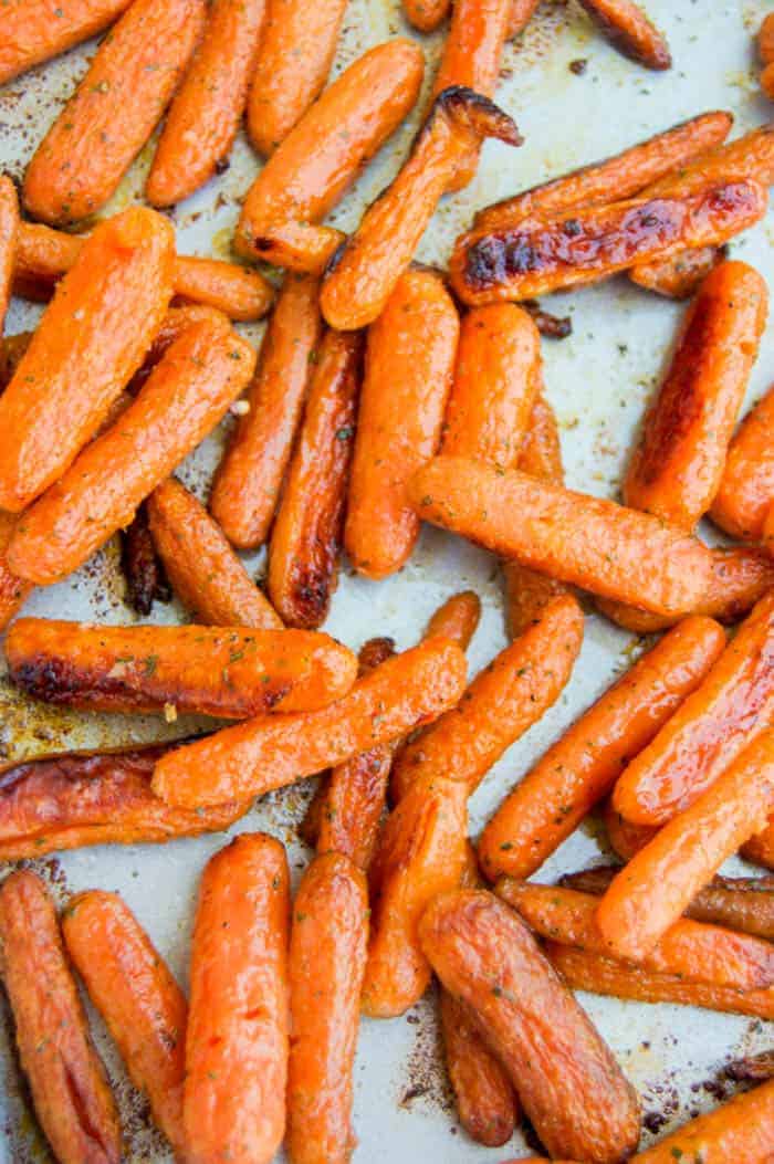 Close up of Roasted Ranch Carrots on baking sheet.