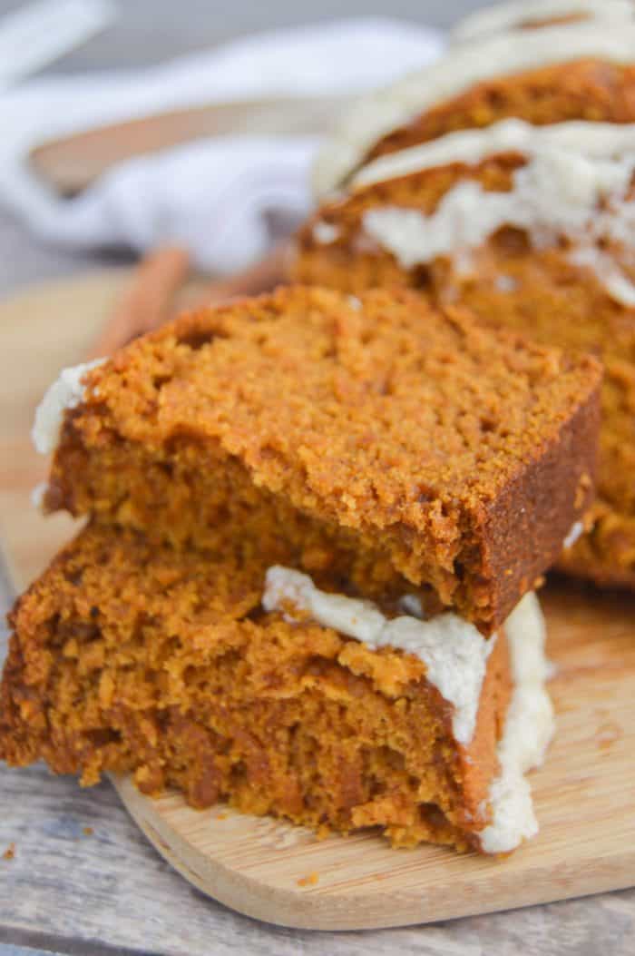 Pumpkin Bread with Maple Icing cut into pieces and stacked on top