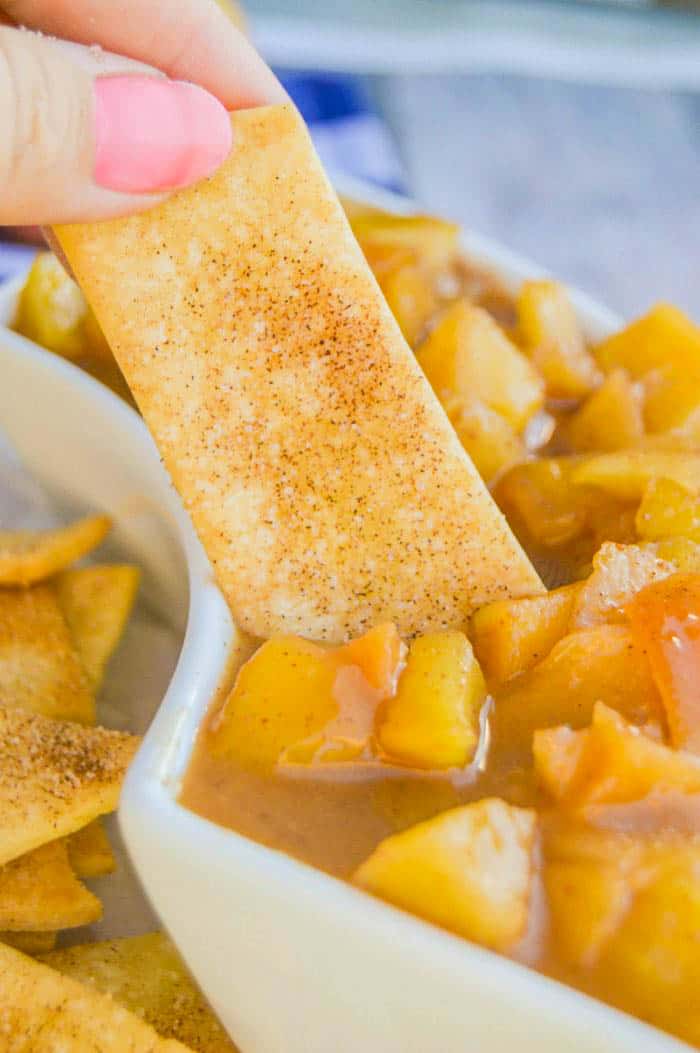 Apple Pie Dip with pie crust dipper in white serving tray close up