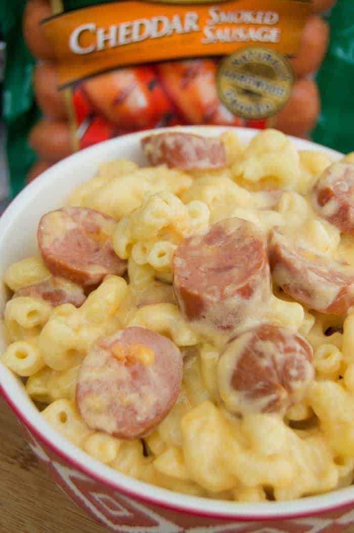 Slow Cooker Mac and Cheese with Cheddar Smoked Sausage in a red bowl