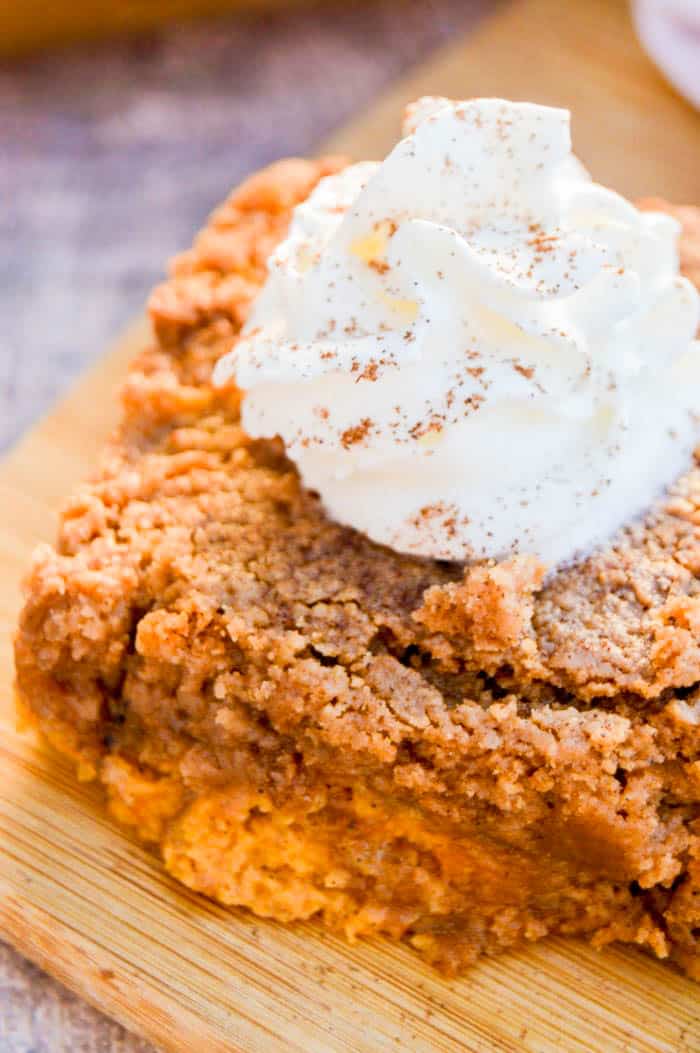 Close up image of Pumpkin Spice Dump Cake with whipped cream