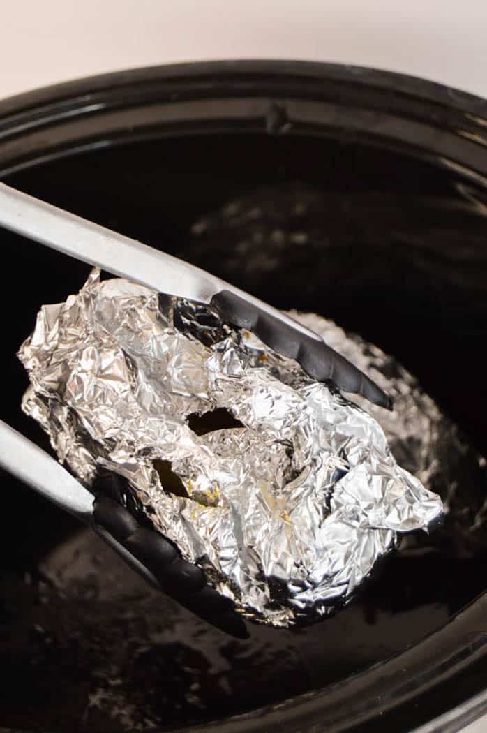 Slow Cooker Baked Potatoes wrapped in foil