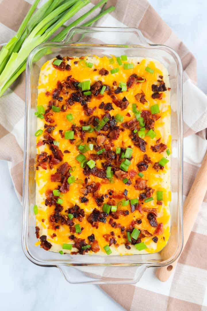 topview of mashed potatoes with green onions on top.