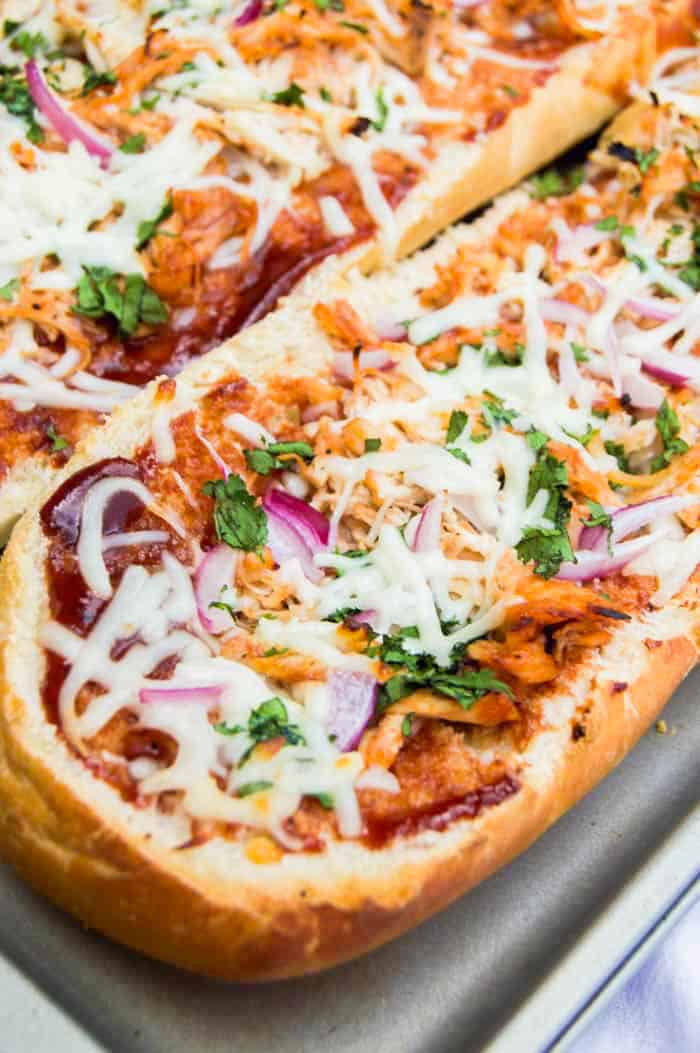 BBQ Chicken French Bread Pizza closeup on baking sheet.