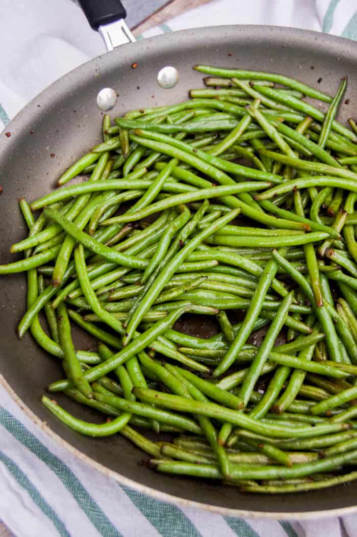 Skillet Green Beans in skillet on white and green cloth