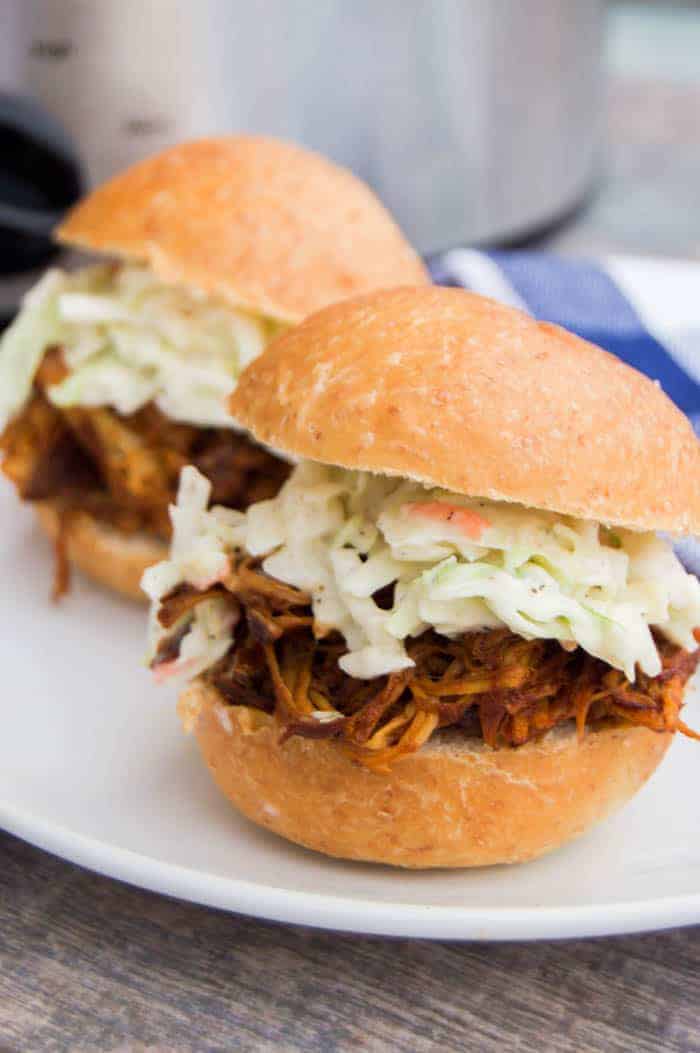 BBQ chicken sliders on a white plate