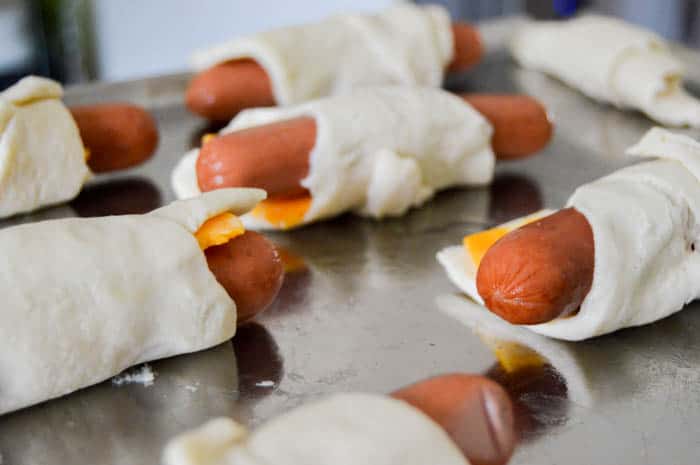 rolled up hot dogs in crescent rolls with cheese.