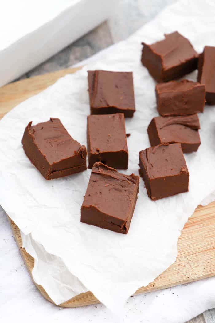 Easy Chocolate Fudge sliced on parchment paper.