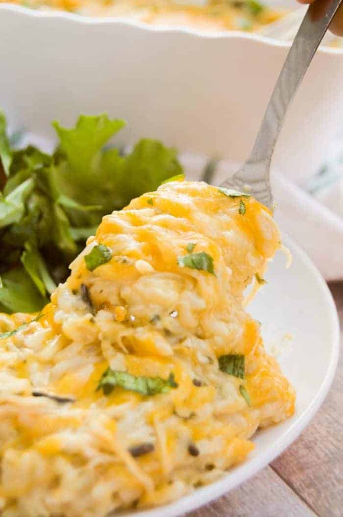 Chicken and Wild Rice Casserole on white plate with salad.