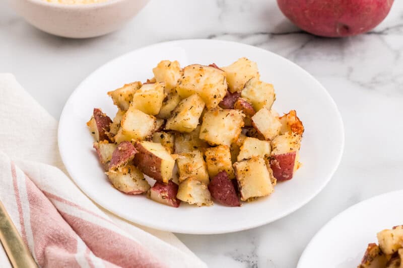 potatoes cooked and placed on a white plate
