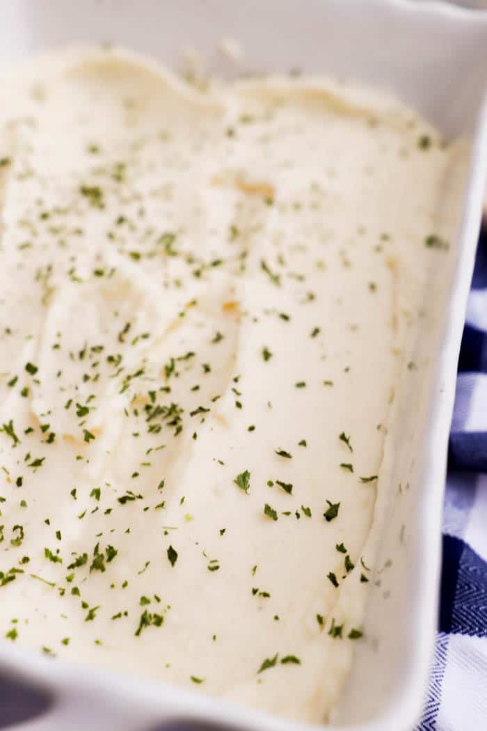 Make Ahead Mashed Potatoes in white casserole dish