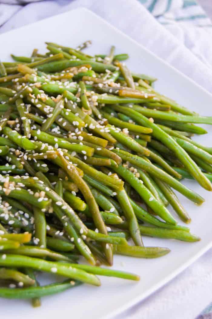 Garlic Asian Green Beans closeup on white plate