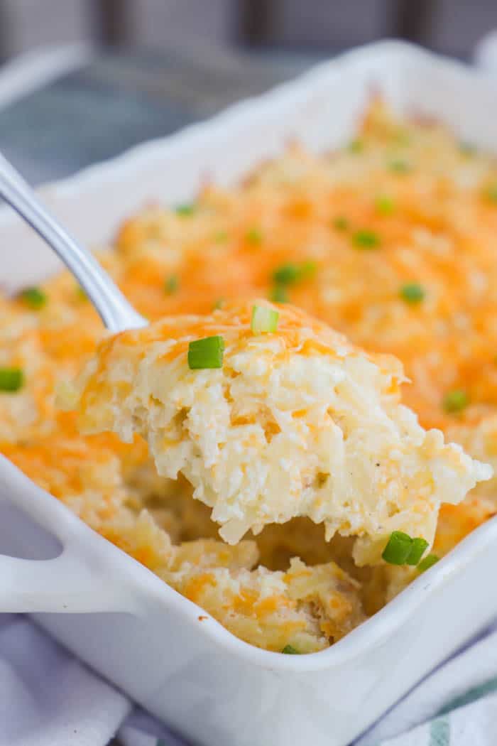 Hashbrown Casserole scooped out on a spoon closeup