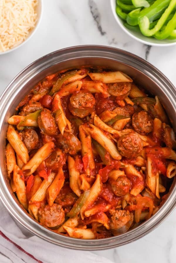 Hearty Italian sausage and peppers stew in a slow cooker.
