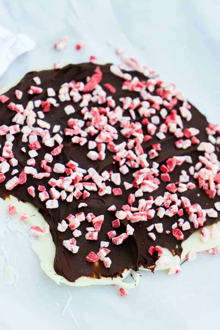 Peppermint Bark before breaking laying on parchment paper