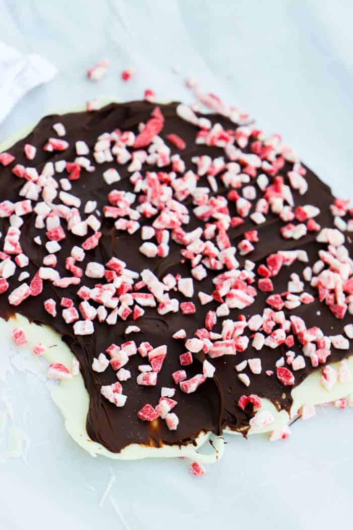 Peppermint Bark before breaking laying on parchment paper