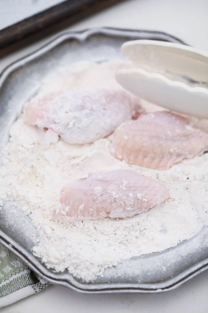 covering your wings in the flour mixture