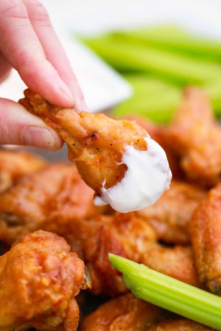 Buffalo Chicken Wing dipped in Blue Cheese.