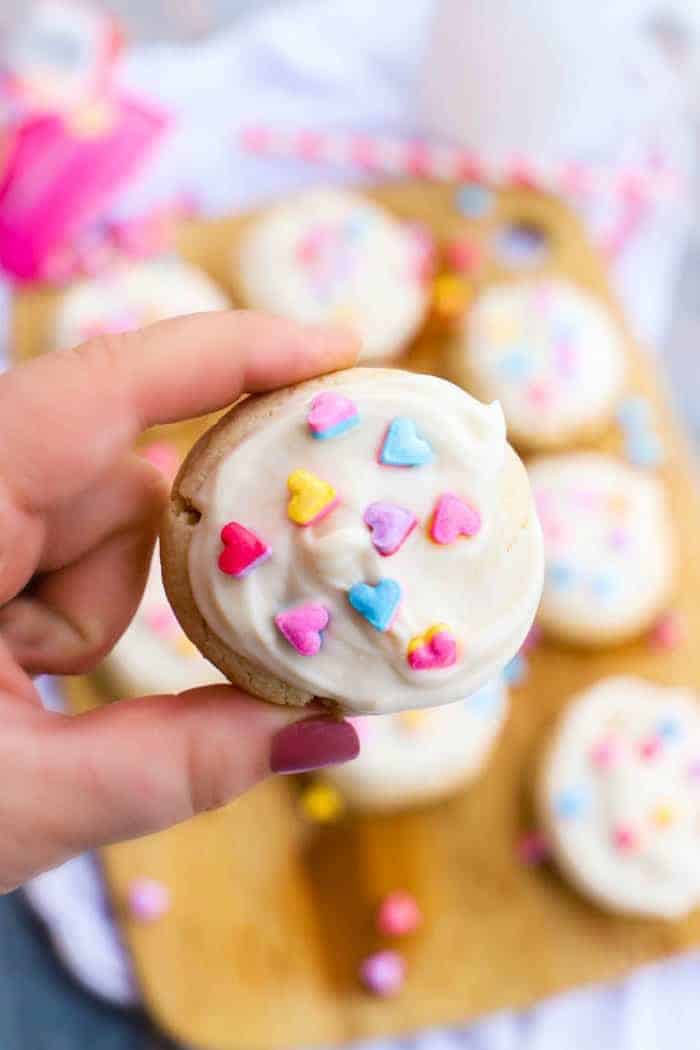 Valentine's Day Sugar Cookie in hand closeup.