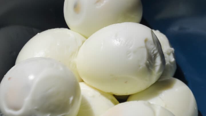 peeled eggs in a bowl