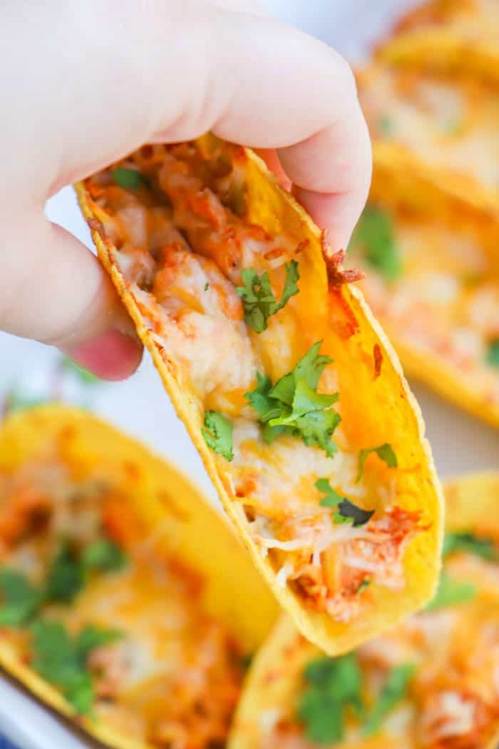 Baked Chicken Tacos being held in a hand