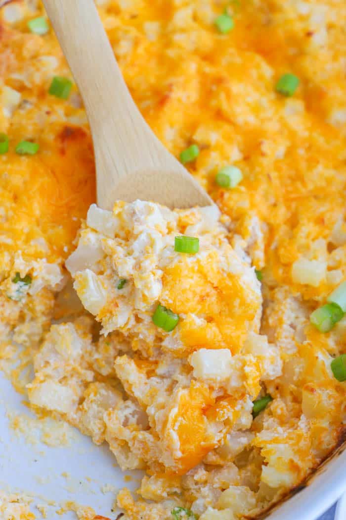 potato casserole with a wooden spoon