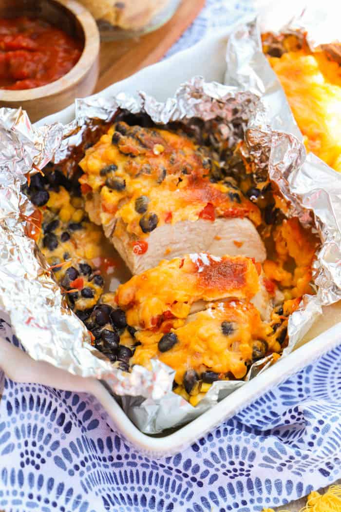 Santa Fe Chicken Foil Packets sliced in a casserole dish