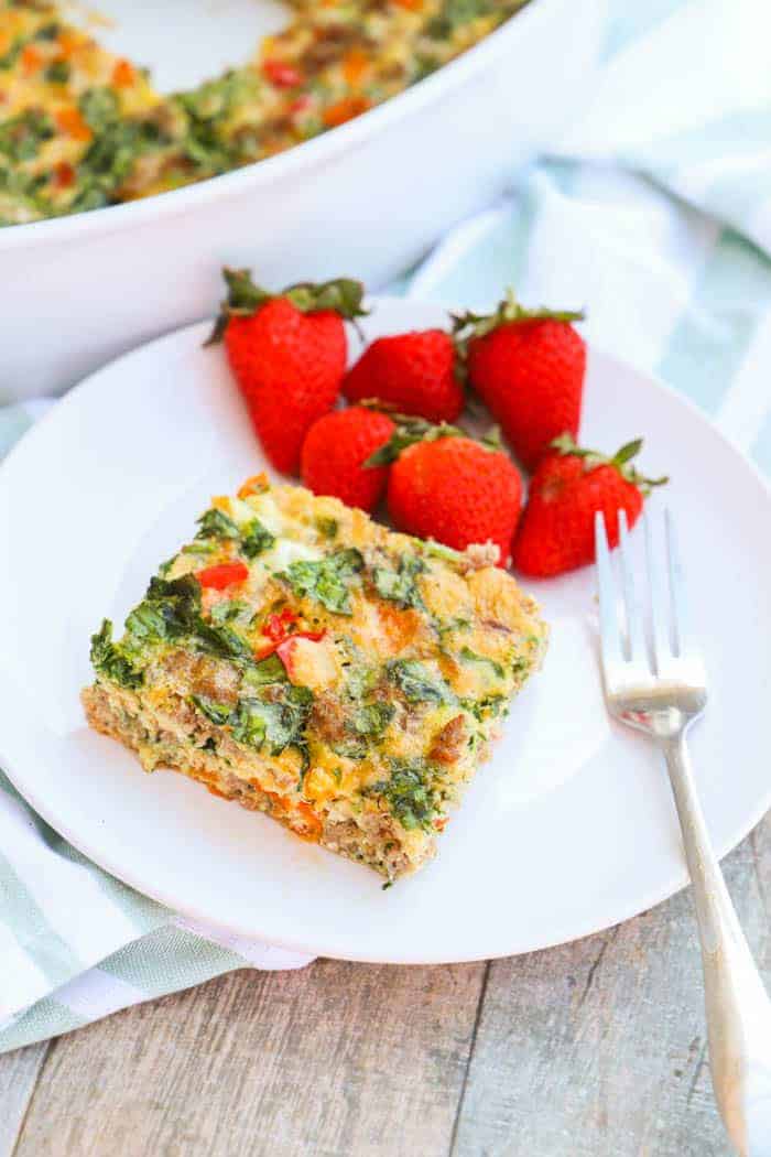 Make Ahead Low Carb Breakfast Casserole on a plate with strawberries