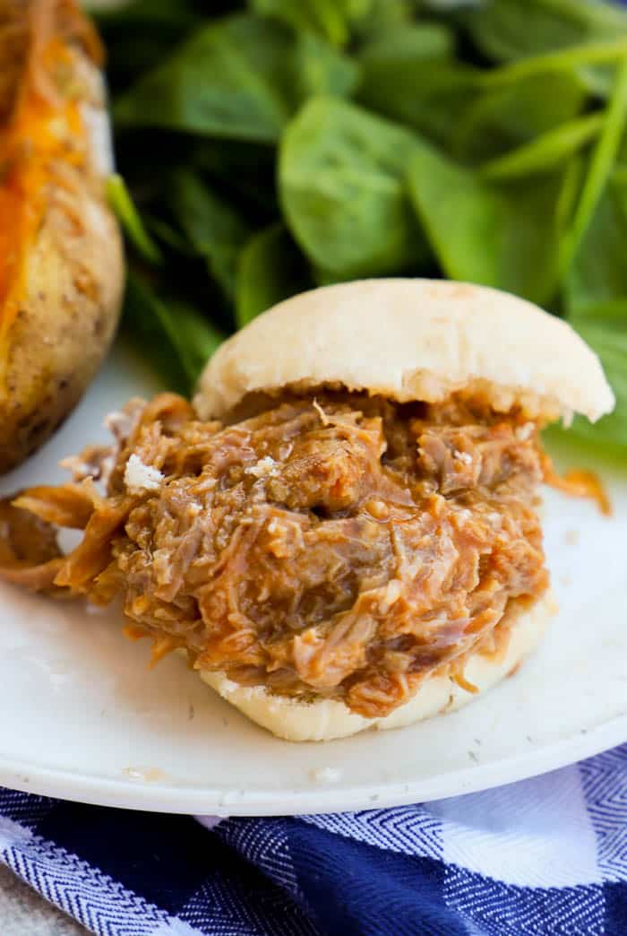 Close up Slow Cooker Pulled Pork Sliders on a white bun