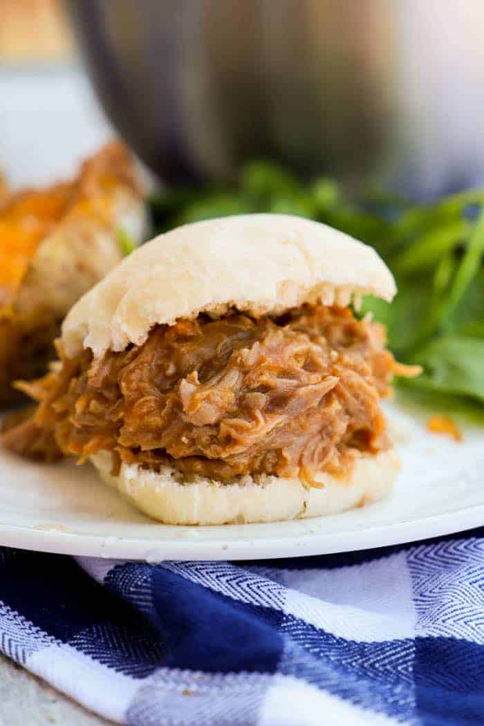 Slow Cooker Pulled Pork Sliders on a white plate