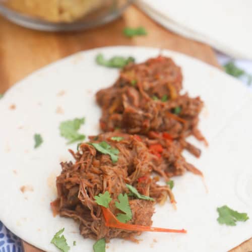 4 Ingredient Slow Cooker Steak Fajita on a tortilla wrap