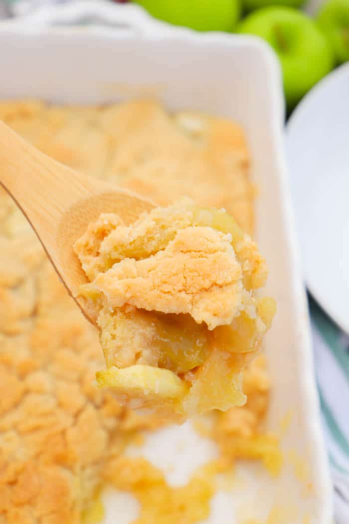 Apple Cobbler on a wooden spoon.