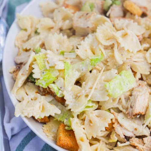 Chicken Caesar Pasta Salad in a white serving bowl