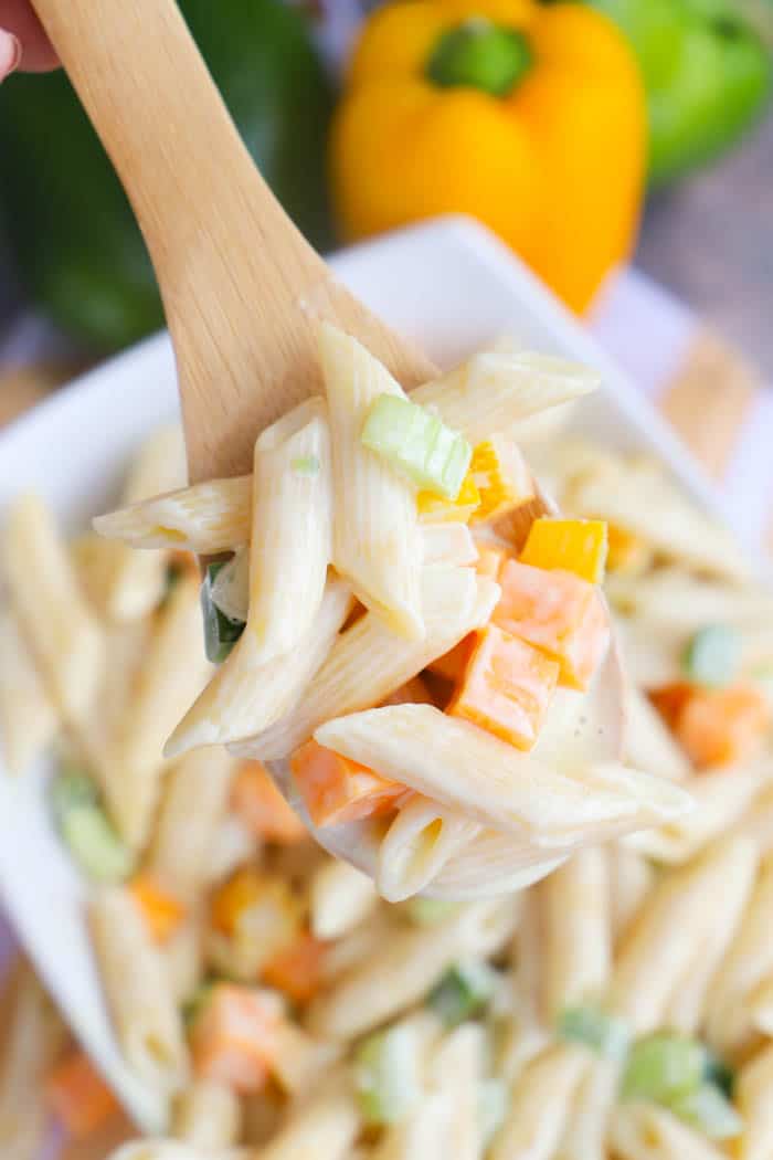 Classic Pasta Salad in a wooden spoon