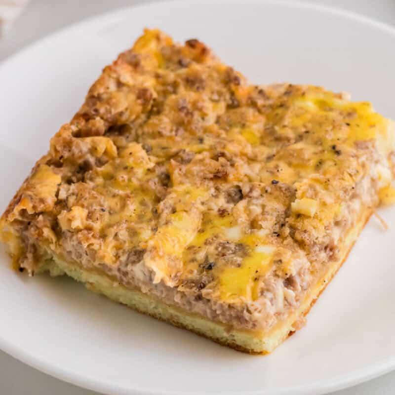 Cream Cheese Sausage Casserole sliced and served on a white plate