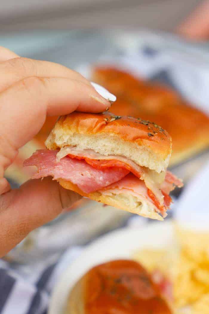 holding a Italian Sliders for dinner