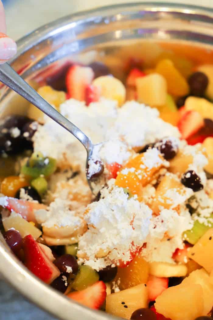 mixing Fruit Salad with sugar