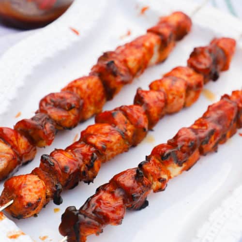 Grilled BBQ Chicken Kabobs on a white plate