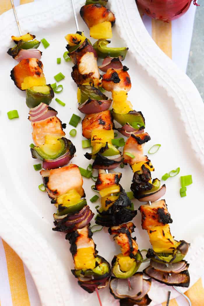 three Hawaiian Chicken Kabobs on metal kabobs