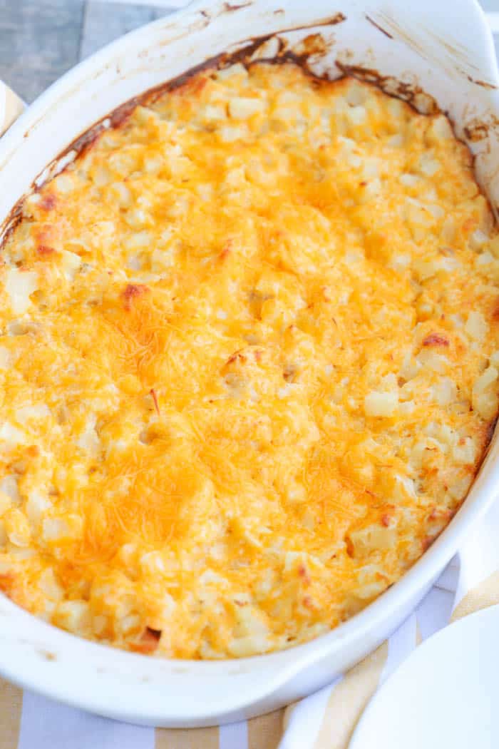 Cheesy Potato Casserole in a white casserole dish