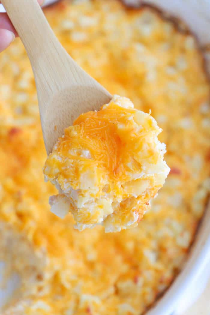 Cheesy Potato Casserole on a wooden spoon