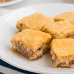 Sausage Cream Cheese Crescent Bake cut into squares on a plate