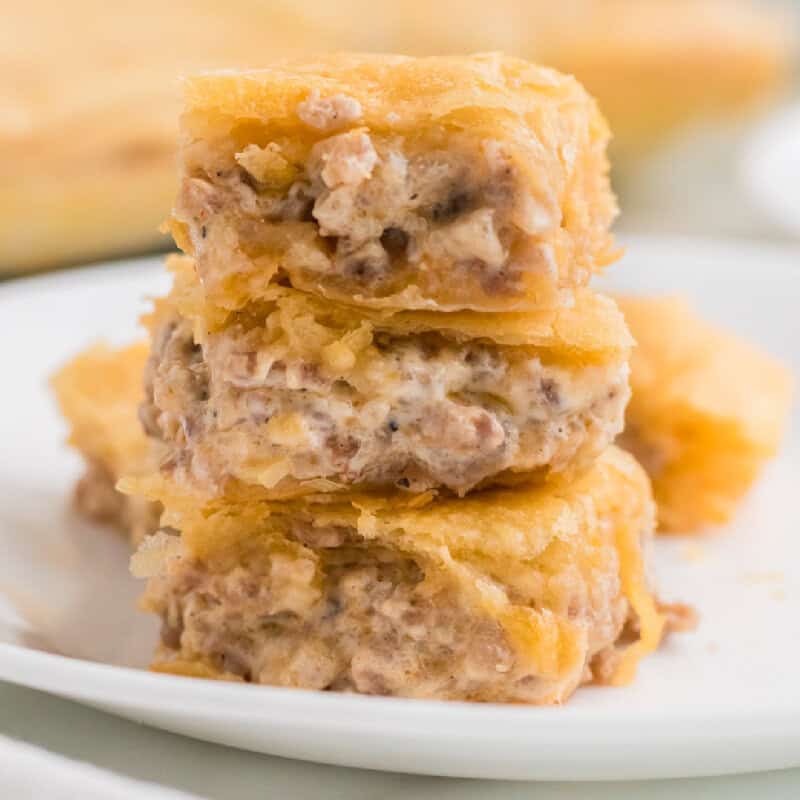 Sausage Cream Cheese Crescent Bake cut into squares on a plate